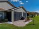 Enclosed patio featuring a brick floor, outdoor furniture, and a grill, perfect for entertaining at 5304 Nicklaus Dr, Winter Haven, FL 33884