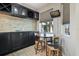 Cozy bar area with wine rack, storage, and seating beside a window with natural light at 629 Copeland Dr, Haines City, FL 33844
