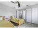 Spacious bedroom with two twin beds, a ceiling fan, and plenty of closet space at 629 Copeland Dr, Haines City, FL 33844