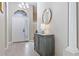 Elegant foyer featuring a decorative cabinet, a stylish mirror, and a modern chandelier, creating a welcoming entrance at 629 Copeland Dr, Haines City, FL 33844