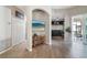 Open-concept living area with tiled floors, arched doorways, and a view of the kitchen and screened patio at 629 Copeland Dr, Haines City, FL 33844