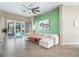 Stylish living room featuring a large sectional sofa, a modern ceiling fan, and sliding doors leading to the pool area at 629 Copeland Dr, Haines City, FL 33844