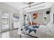 Well-lit main bedroom features a canopy bed frame, wood-look floors, and an outdoor patio view at 629 Copeland Dr, Haines City, FL 33844