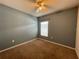 Standard bedroom with neutral carpet, ceiling fan and window with blind providing ample natural light at 663 Lucerne Blvd, Winter Haven, FL 33881