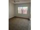 Bedroom with carpet and a window at 683 Broadmoor Cir # 683, Winter Haven, FL 33884