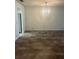 Bright dining room features tile flooring and modern chandelier at 683 Broadmoor Cir # 683, Winter Haven, FL 33884