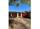 Inviting home exterior with a red fence, secured gate, and well-kept walkway at 683 Broadmoor Cir # 683, Winter Haven, FL 33884