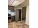 Modern kitchen with stainless steel appliances, dark wood cabinets, and tiled floor at 683 Broadmoor Cir # 683, Winter Haven, FL 33884