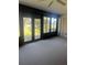 Neutral carpeted sunroom with multiple windows offering bright outdoor views and natural lighting at 683 Broadmoor Cir # 683, Winter Haven, FL 33884