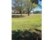 Expansive lawn with mature shade trees at 683 Broadmoor Cir # 683, Winter Haven, FL 33884