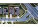 Aerial view highlighting the property's boundaries, solar panels, and proximity to the street at 708 Simone Ct, Haines City, FL 33844