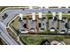 Aerial view outlining property with solar panels, patio with furniture, fire pit and street at 708 Simone Ct, Haines City, FL 33844
