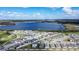 Community aerial view showcasing a large lake, residential homes, and a neighborhood layout at 708 Simone Ct, Haines City, FL 33844
