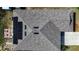 Roof view featuring solar panels, skylights, backyard patio furniture and a fire pit at 708 Simone Ct, Haines City, FL 33844