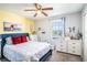 Bright bedroom showcasing a large window, soft carpet, and stylish decor at 708 Simone Ct, Haines City, FL 33844