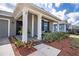 Charming front porch with decorative plants and a welcoming entrance at 708 Simone Ct, Haines City, FL 33844