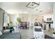 Open concept living space showcasing the dining area, kitchen with breakfast bar, and living room with comfortable seating at 708 Simone Ct, Haines City, FL 33844