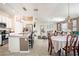 Bright, open-concept living area seamlessly connecting the kitchen, dining area, and living room at 708 Simone Ct, Haines City, FL 33844