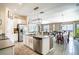 Inviting open-concept design with kitchen island, dining space, and comfortable living room at 708 Simone Ct, Haines City, FL 33844