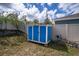 Outdoor blue and white shed for all your storage needs at 708 Simone Ct, Haines City, FL 33844