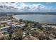 Stunning aerial view showcasing proximity to the lake and surrounding neighborhood at 750 Avenue O Sw, Winter Haven, FL 33880