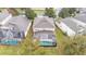 Aerial view of a home with a large, screened-in pool at 7759 Basnett Cir, Kissimmee, FL 34747