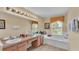 Bright bathroom with double sinks, a soaking tub, and large windows for natural light at 7759 Basnett Cir, Kissimmee, FL 34747