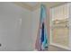 Bright bathroom featuring a tub with a themed shower curtain and a window at 7759 Basnett Cir, Kissimmee, FL 34747