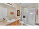 Bathroom features a shower with glass doors and a single sink vanity at 7759 Basnett Cir, Kissimmee, FL 34747