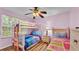 Cozy bedroom features bunk beds, bright colors, and comfortable furnishings at 7759 Basnett Cir, Kissimmee, FL 34747