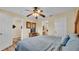 Comfortable bedroom featuring wood-look floors and multiple entryways at 7759 Basnett Cir, Kissimmee, FL 34747