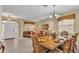 Formal dining room features beautiful wood table with seating for eight at 7759 Basnett Cir, Kissimmee, FL 34747