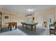 Spacious garage area with a pool table and foosball table at 7759 Basnett Cir, Kissimmee, FL 34747