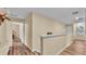 Second floor hallway features hardwood floors and access to bedrooms at 7759 Basnett Cir, Kissimmee, FL 34747