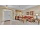 Inviting living room features tile flooring, large windows, and comfortable seating at 7759 Basnett Cir, Kissimmee, FL 34747