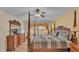 A bedroom with a four post bed frame and matching dressers at 7759 Basnett Cir, Kissimmee, FL 34747