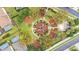 Aerial shot of a community playground with equipment and mature landscaping at 7759 Basnett Cir, Kissimmee, FL 34747
