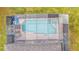 A birds-eye view of a private screened-in pool and patio area at 7759 Basnett Cir, Kissimmee, FL 34747