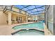 An inviting screened-in pool with a covered patio, perfect for outdoor entertaining at 7759 Basnett Cir, Kissimmee, FL 34747