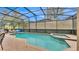 Enjoy the screened-in pool and spa area, perfect for relaxation and entertainment at 7759 Basnett Cir, Kissimmee, FL 34747
