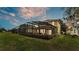 A screened-in back patio for outdoor living and entertaining in a grassy yard at 7759 Basnett Cir, Kissimmee, FL 34747