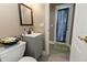 Bathroom features a modern vanity and a view into the backyard at 819 Hart Lake St, Winter Haven, FL 33884