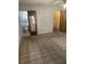 Bedroom includes carpet, fan, and closet, located near the en-suite bathroom at 907 Van Dr, Auburndale, FL 33823