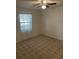 Neutral bedroom featuring carpet floors, a ceiling fan, a window, and a closet at 907 Van Dr, Auburndale, FL 33823