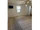 Neutral bedroom featuring carpet floors, a ceiling fan, a window, and a closet at 907 Van Dr, Auburndale, FL 33823