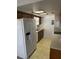 Efficient kitchen design with durable tile flooring and a sun-filled sky light at 907 Van Dr, Auburndale, FL 33823