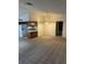 Open-concept design featuring a bright breakfast bar that seamlessly transitions into a generous living space at 907 Van Dr, Auburndale, FL 33823