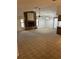 Spacious living room with a vaulted ceiling, large windows and a striking wooden fireplace at 907 Van Dr, Auburndale, FL 33823