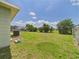 A spacious backyard with lush green grass and room for outdoor activities at 91 W Cedarwood Cir, Kissimmee, FL 34743