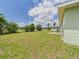 Expansive backyard with trees surrounding the perimeter at 91 W Cedarwood Cir, Kissimmee, FL 34743